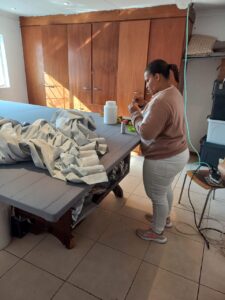 Getting thread into needle... weights need to be inserted and has to be stitched by hand then. 2